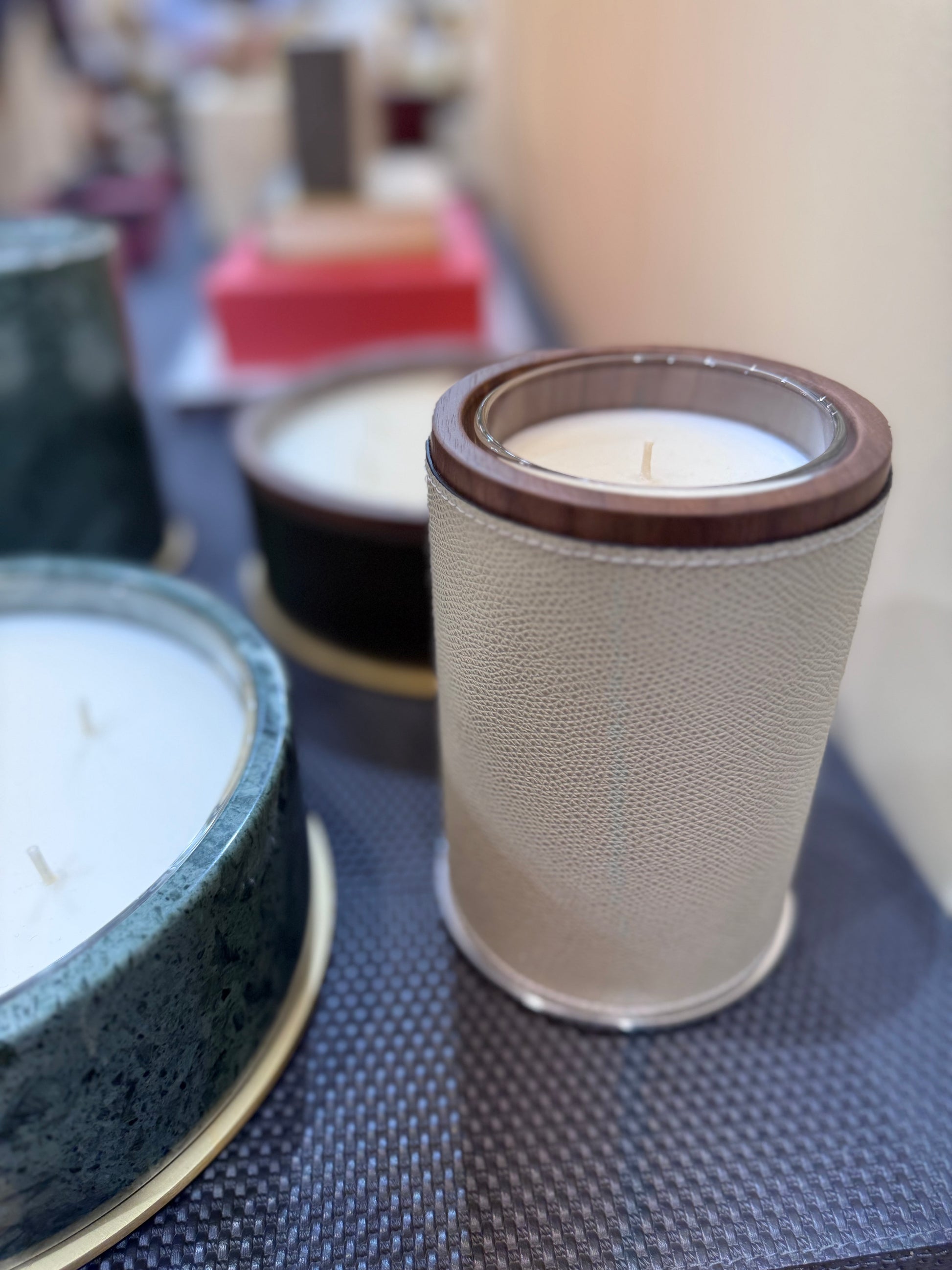 Giobagnara Positano | Candle Holder: Leather with walnut wood trim and metal base, smooth finish, with removable wax candle insert | Decor / Vases & Candle Holders | 2Jour Concierge, your luxury lifestyle shop | luxury interiors, hospitality décor, elegant living, designer home accessories, boutique hotels, refined lifestyle, yacht décor