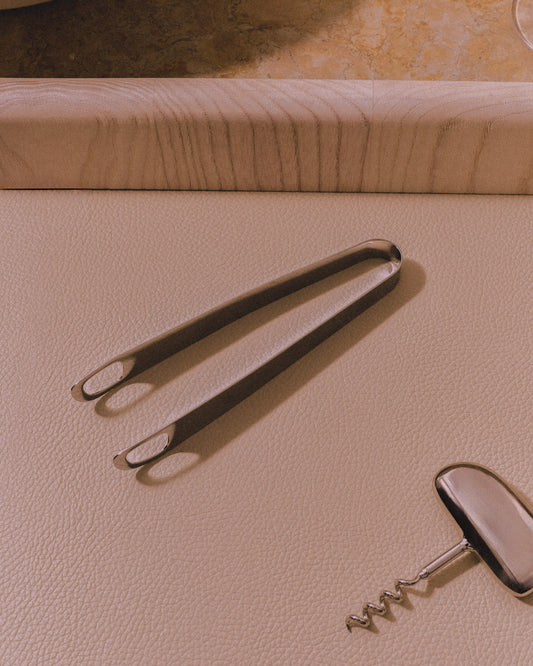 Giobagnara x Kelly Wearstler Maris Bar Accessories Set
Maris Bar Accessories Set | Marble structure with sandblasted aluminum accents, available in five elegant finishes | Includes polished stainless steel tools: corkscrew, cocktail picks, bottle opener, knife, ice tongs, mixing spoon, and leather coasMaris Ice Tongs | Polished stainless steel ice tongs with flowing lines for a stylish cocktail-making experience | Durable and sophisticated | Barware Accessories | 2Jour Concierge, your luxury lifestyle shop