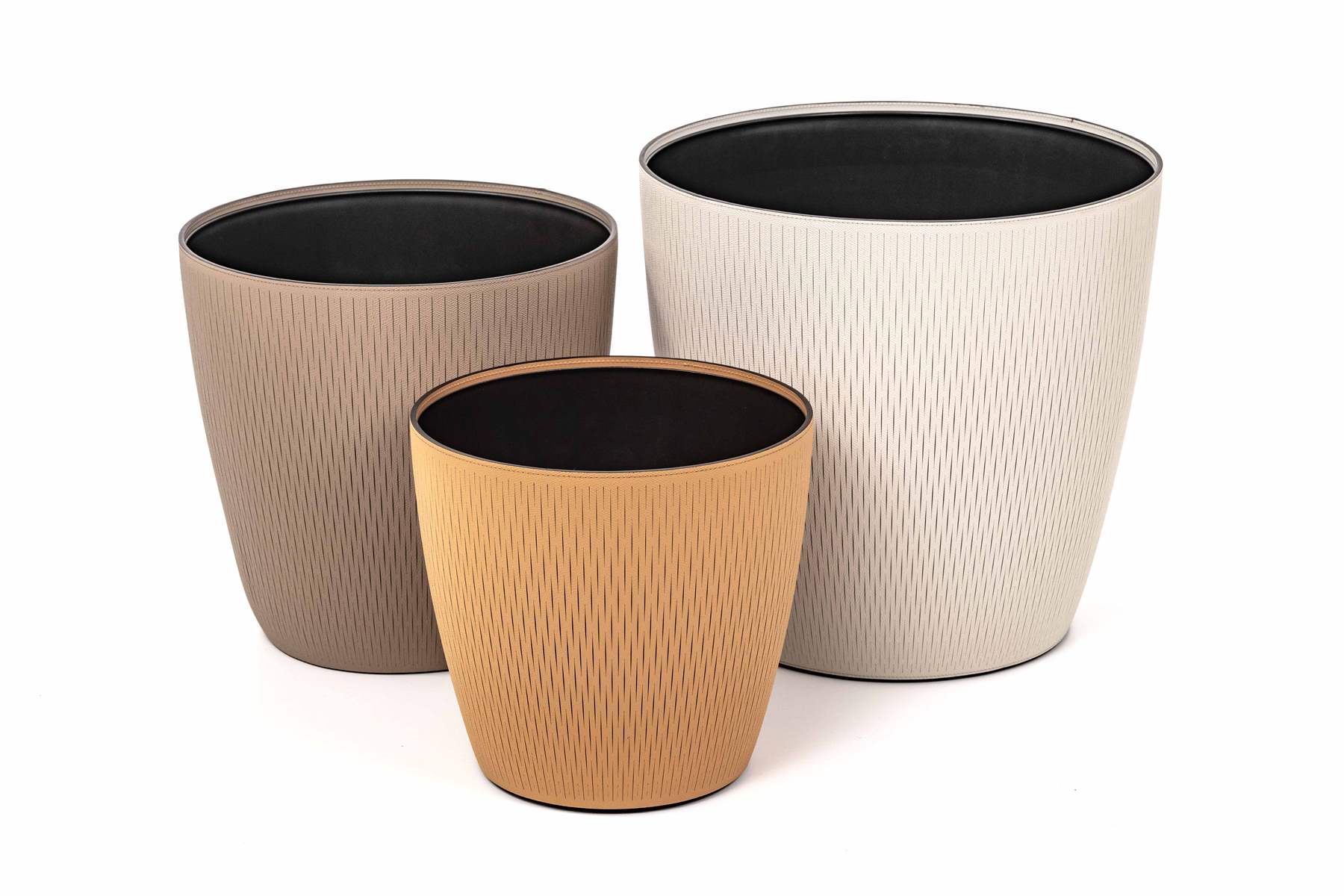 Pinetti Silvy Plastic Flower Pot With Removable Regenerated Leather Cover | Plastic structure with removable leather cover | Available in six different dimensions, with the three larger sizes featuring wheels for easy mobility | Explore Luxury Lifestyle Accessories at 2Jour Concierge, #1 luxury high-end gift & lifestyle shop
