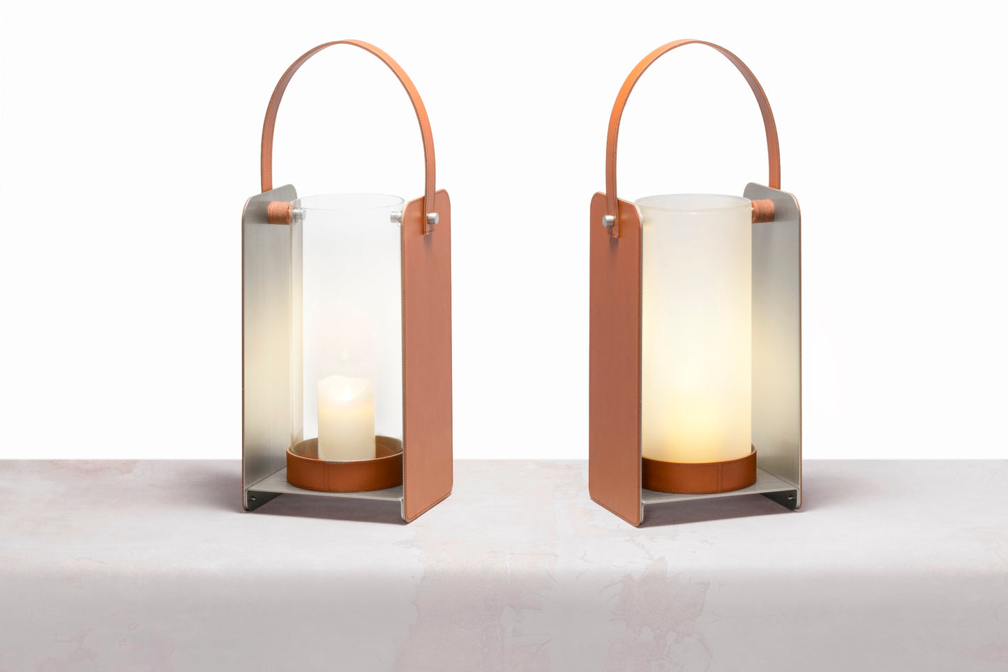 Lumen Lantern by Rabitti 1969 | Aluminium structure with saddle leather decorative external cover | Borosilicate glass tube space, available in transparent or white frosted versions | Designed by Simone Fanciullacci | Home Decor and Lighting | 2Jour Concierge, your luxury lifestyle shop