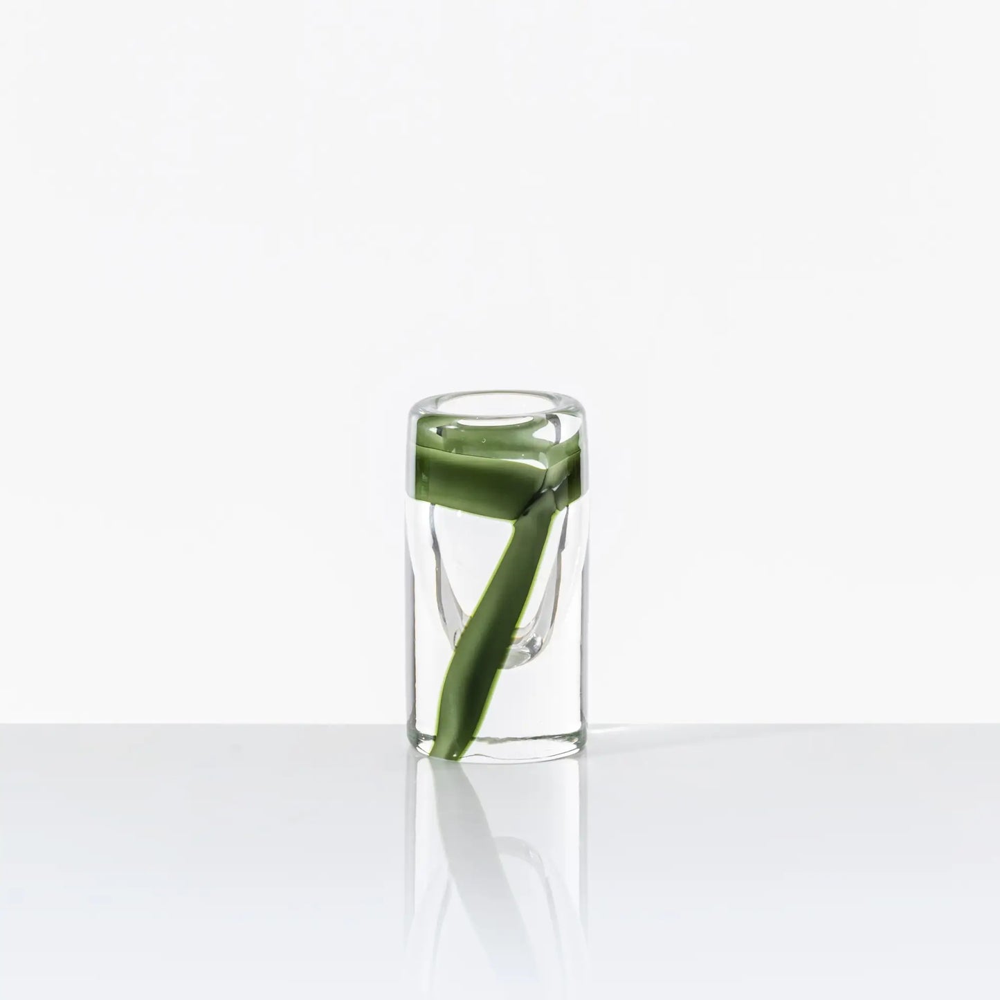 Cilindro Murano Glass Vase by Venini | New color variations featuring transparent bands in Tea or Green Apple-Milk White, creating an elegant contrast with crystal clear glass | Tea color version adorned with glazed Gold decorations | Designer: Peter Marino | Limited edition of 349 art works | Available in heights of 14 and 40 centimeters | Home Decor Vases | 2Jour Concierge, your luxury lifestyle shop