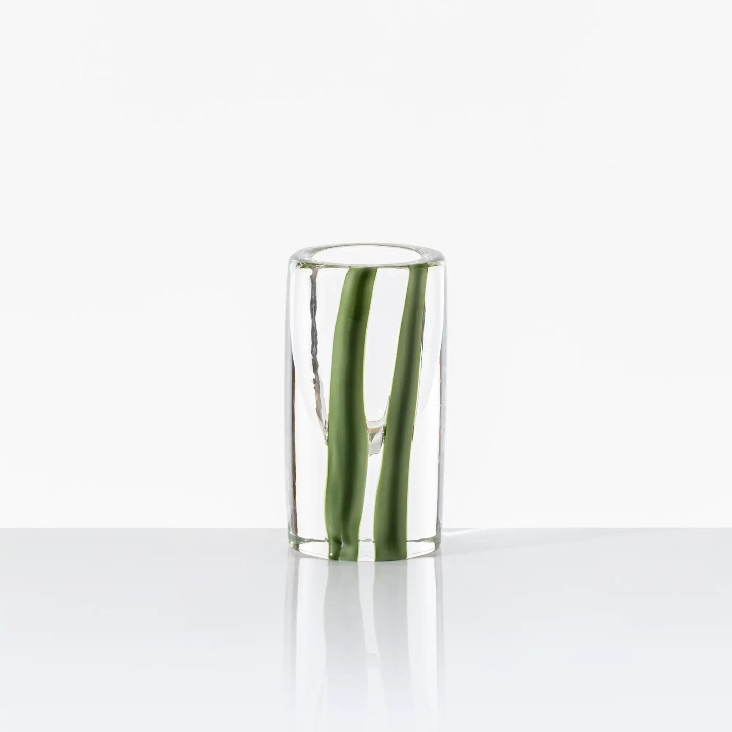 Cilindro Murano Glass Vase by Venini | New color variations featuring transparent bands in Tea or Green Apple-Milk White, creating an elegant contrast with crystal clear glass | Tea color version adorned with glazed Gold decorations | Designer: Peter Marino | Limited edition of 349 art works | Available in heights of 14 and 40 centimeters | Home Decor Vases | 2Jour Concierge, your luxury lifestyle shop