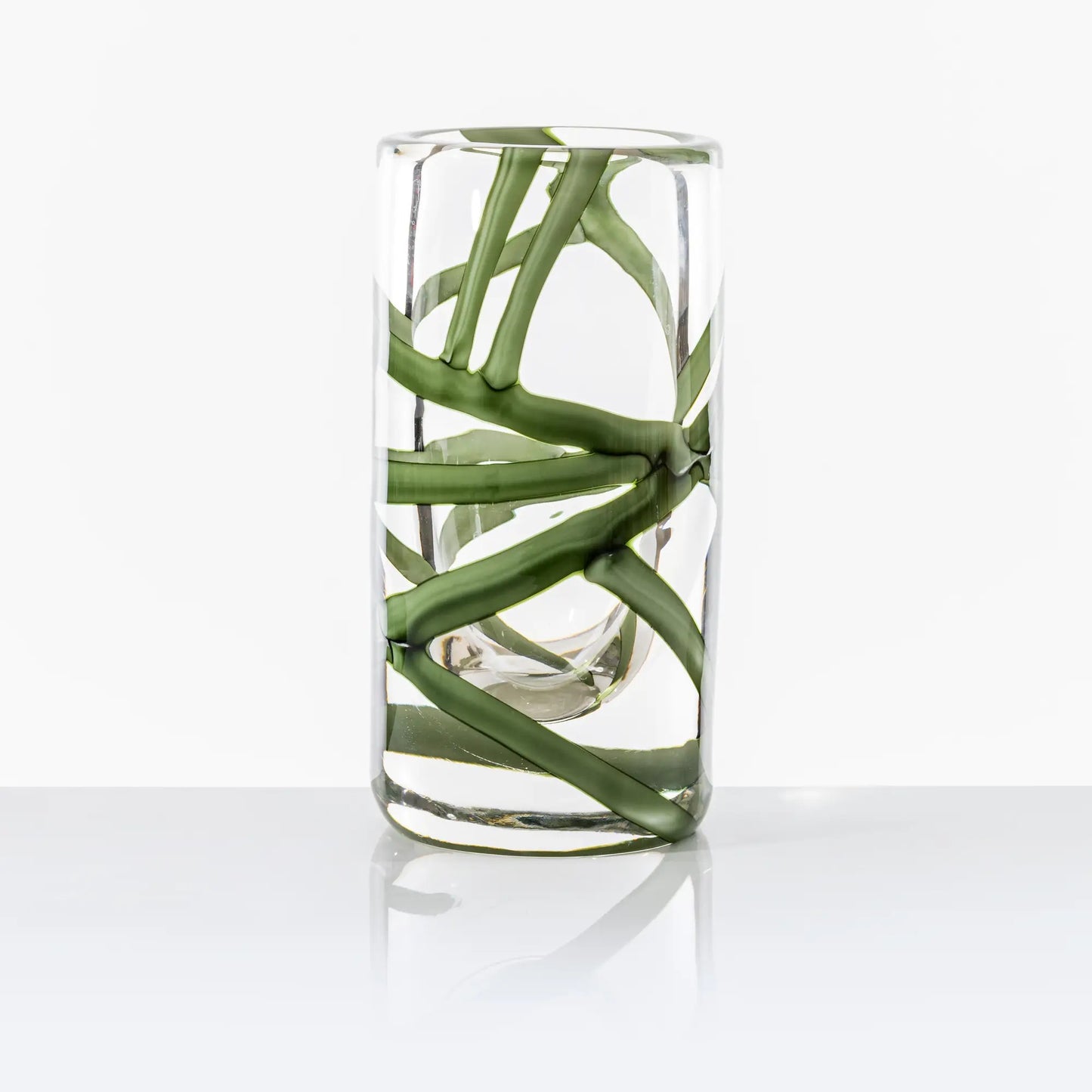 Cilindro Murano Glass Vase by Venini | New color variations featuring transparent bands in Tea or Green Apple-Milk White, creating an elegant contrast with crystal clear glass | Tea color version adorned with glazed Gold decorations | Designer: Peter Marino | Limited edition of 349 art works | Available in heights of 14 and 40 centimeters | Home Decor Vases | 2Jour Concierge, your luxury lifestyle shop
