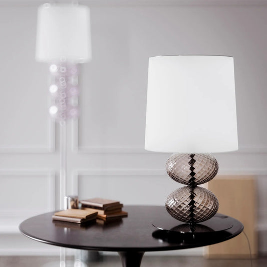 Abat-Jour Lamp by Venini | Stem features spheres capturing light reflections with surface texture from the ancient "balloton" technique | Table lamp adorned with one to three blown glass "balloton" elements in various colors | Base available in chrome-plated or black nickel metal | White fabric lampshade | Home Decor Lighting | 2Jour Concierge, your luxury lifestyle shop