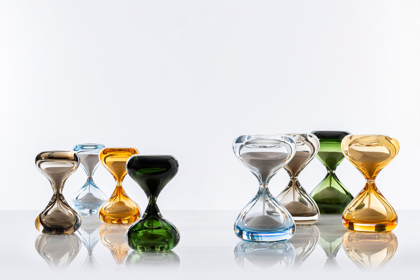 Clessidre Sommerse by Venini | New series enriching the collection designed by Fulvio Bianconi and Paolo Venini | Submerged glass envelops two blown glass pieces, utilizing the incalmo technique to hold the flow of grains | Timeless jewels representing the relentless passage of time | Home Decor | 2Jour Concierge, your luxury lifestyle shop