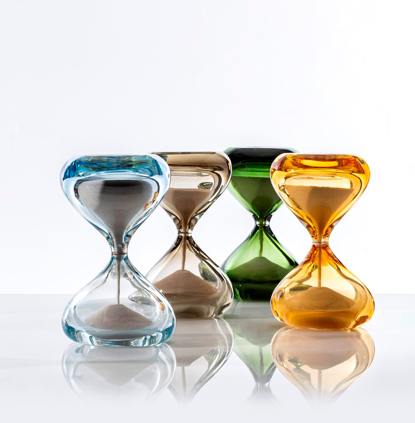 Clessidre Sommerse by Venini | New series enriching the collection designed by Fulvio Bianconi and Paolo Venini | Submerged glass envelops two blown glass pieces, utilizing the incalmo technique to hold the flow of grains | Timeless jewels representing the relentless passage of time | Home Decor | 2Jour Concierge, your luxury lifestyle shop