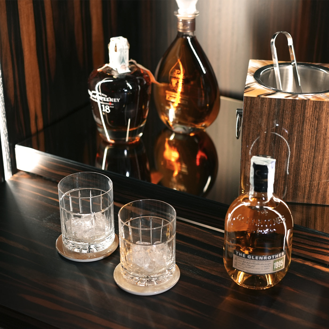 Arcahorn Manhattan Wine Cellar Cabinet | Matte Makassar Ebony Veneer | Burnished Brass Handles with Multifaceted Horn Gems | Backlit Interior in Ebony and Oak Veneer | Sliding Trays for Wine, Champagne, and Magnum Bottles | Multi-temperature Refrigeration System | Explore Luxury Home Accessories at 2Jour Concierge, #1 luxury high-end gift & lifestyle shop