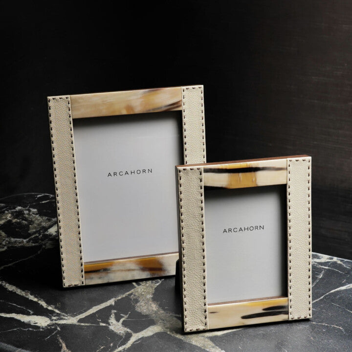 Arcahorn Dorotea Picture Frame | Glossy Horn and Aida Pebbled Leather in Ice-Cream with Handmade Dark Brown Stitching | Matte Amara Ebony Veneer Rim and Back | Designed by Filippo Dini | Ideal for Yachts and Offices | Explore Luxury Home Accessories at 2Jour Concierge, #1 luxury high-end gift & lifestyle shop