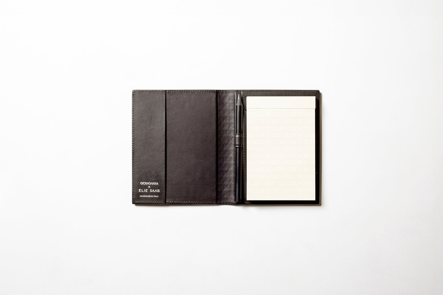 Giobagnara x Elie Saab Monogram Notepad Holder | Padded leather cover featuring the Elie Saab Monogram pattern and suede lining | Includes an elastic pencil holder with pen and a notepad with 70 ivory sheets | Available in small (A6), medium (A5), and large (A4) sizes | Office Accessories | 2Jour Concierge, your luxury lifestyle shop