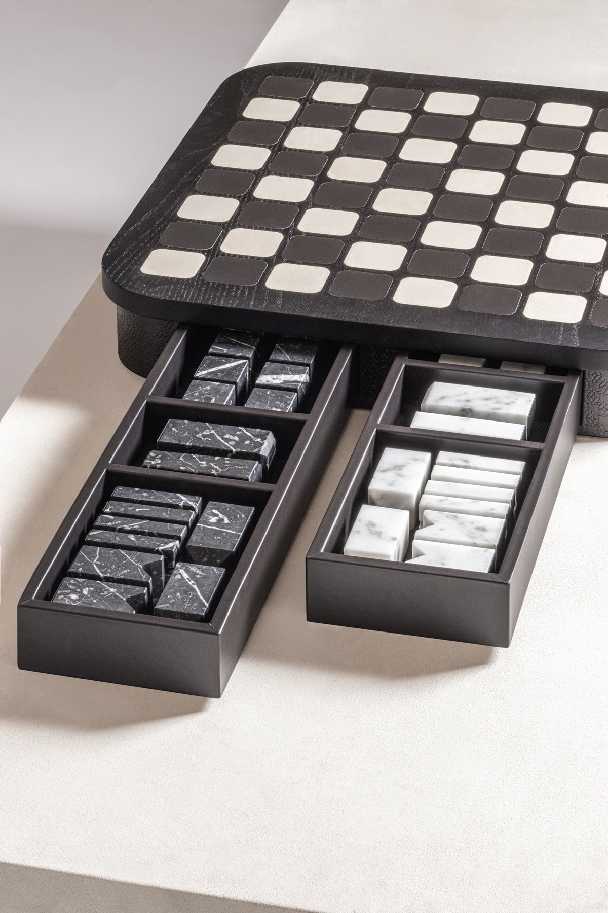 Giobagnara x Elie Saab Monogram Big Chess Game Set | Wood structure with fine leather inserts on top and a leather base featuring the Elie Saab Monogram pattern | Base encases magnetic drawers for storing playing pieces | Includes two sets of chess pieces made from white Carrara and black Marquinia marbles | Elegant and luxurious chess set | Home Decor and Games | 2Jour Concierge, your luxury lifestyle shop