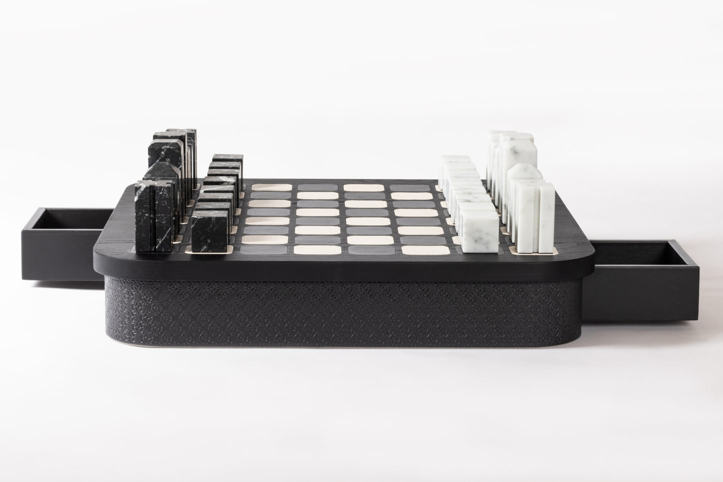 Giobagnara x Elie Saab Monogram Big Chess Game Set | Wood structure with fine leather inserts on top and a leather base featuring the Elie Saab Monogram pattern | Base encases magnetic drawers for storing playing pieces | Includes two sets of chess pieces made from white Carrara and black Marquinia marbles | Elegant and luxurious chess set | Home Decor and Games | 2Jour Concierge, your luxury lifestyle shop