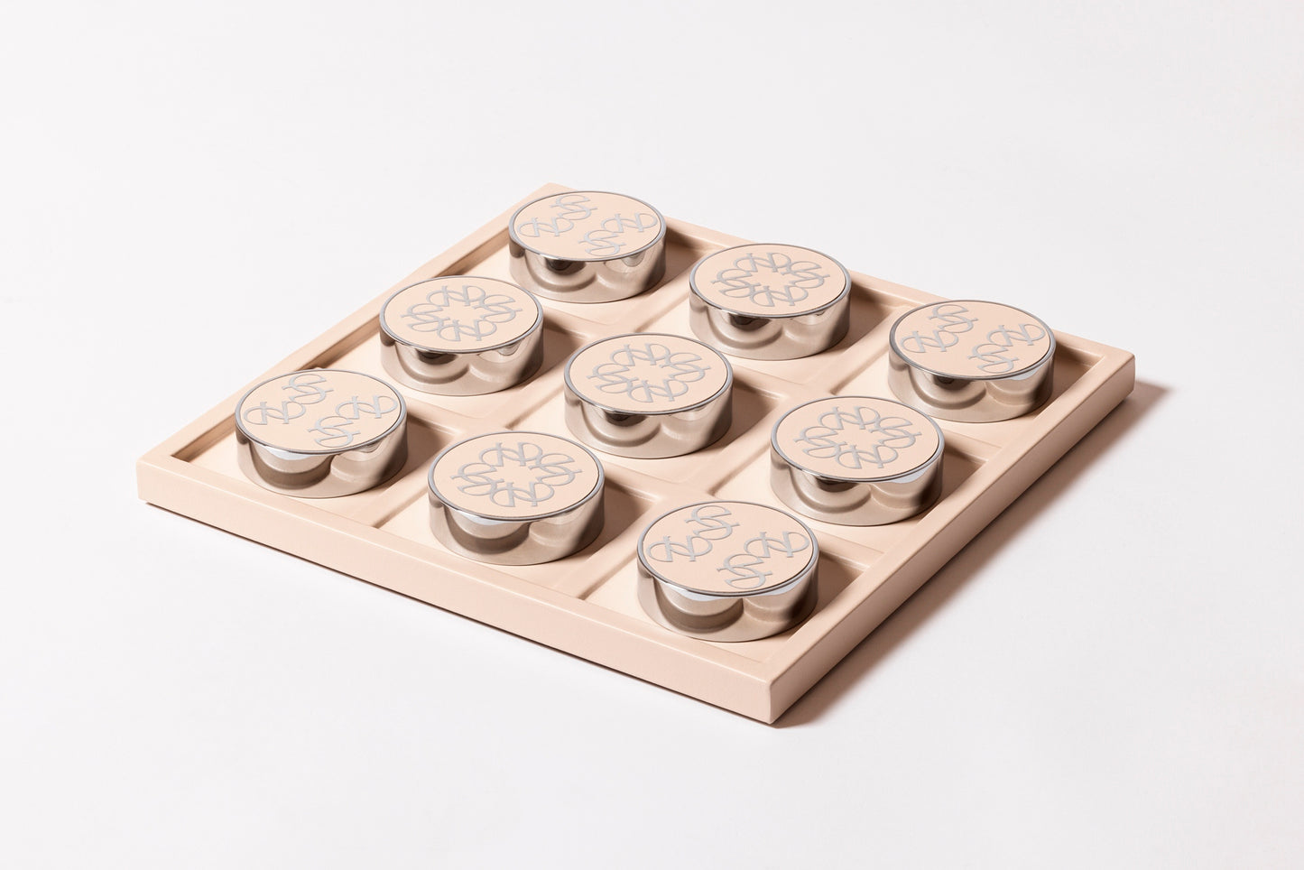 Giobagnara x Elie Saab Ecusson Tic Tac Toe | Leather tray with dividers featuring the Elie Saab Monogram pattern | Includes polished palladium playing pieces with leather inserts and shiny silver debossed decorations | Games and Entertainment | 2Jour Concierge, your luxury lifestyle shop