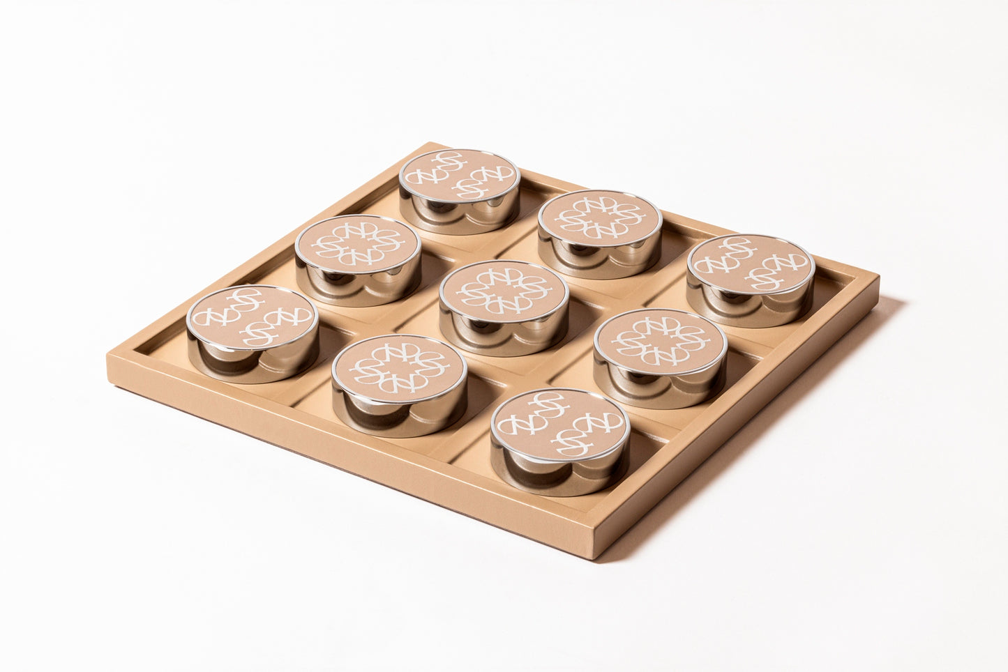 Giobagnara x Elie Saab Ecusson Tic Tac Toe | Leather tray with dividers featuring the Elie Saab Monogram pattern | Includes polished palladium playing pieces with leather inserts and shiny silver debossed decorations | Games and Entertainment | 2Jour Concierge, your luxury lifestyle shop