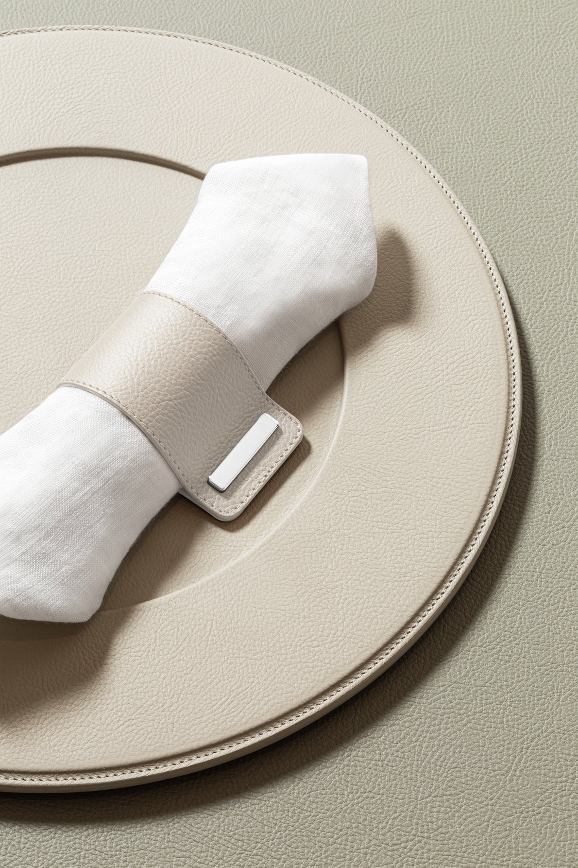Giobagnara x Poltrona Frau Leather Napkin Ring | All-Leather Structure with Polished Chrome Closing | Elevates Table Decor with Subtle Elegance | Made in Pelle Frau® Leather | Discover Luxury Table Accessories at 2Jour Concierge, #1 luxury high-end gift & lifestyle shop