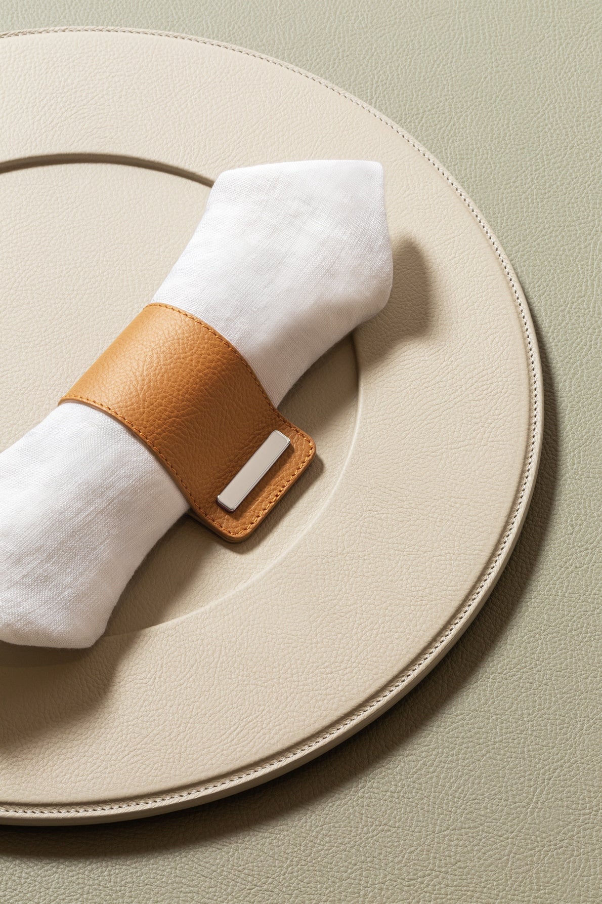 Giobagnara x Poltrona Frau Leather Napkin Ring | All-Leather Structure with Polished Chrome Closing | Elevates Table Decor with Subtle Elegance | Made in Pelle Frau® Leather | Discover Luxury Table Accessories at 2Jour Concierge, #1 luxury high-end gift & lifestyle shop