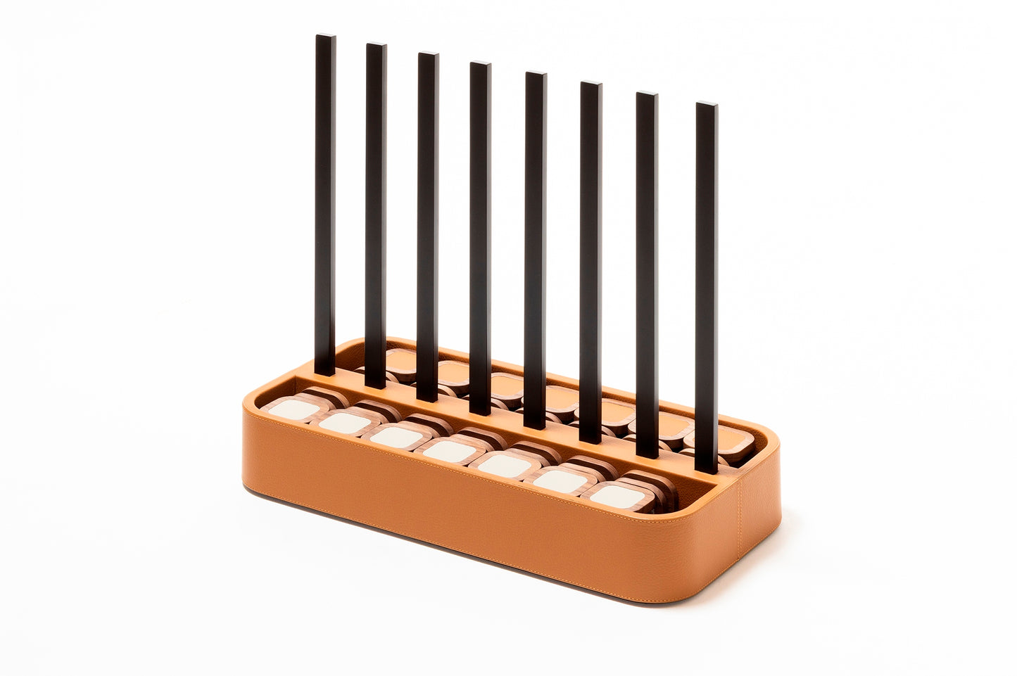 Giobagnara x Poltrona Frau connect 4 | Leather-covered base with walnut wood playing pieces featuring fine leather inserts | Accented with burnished brushed bronze details | A stylish, elevated take on a timeless game | Entirely made in Pelle Frau® | Home decor & game sets | 2Jour Concierge, your luxury lifestyle shop