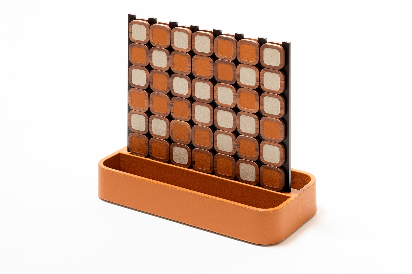 Giobagnara x Poltrona Frau connect 4 | Leather-covered base with walnut wood playing pieces featuring fine leather inserts | Accented with burnished brushed bronze details | A stylish, elevated take on a timeless game | Entirely made in Pelle Frau® | Home decor & game sets | 2Jour Concierge, your luxury lifestyle shop