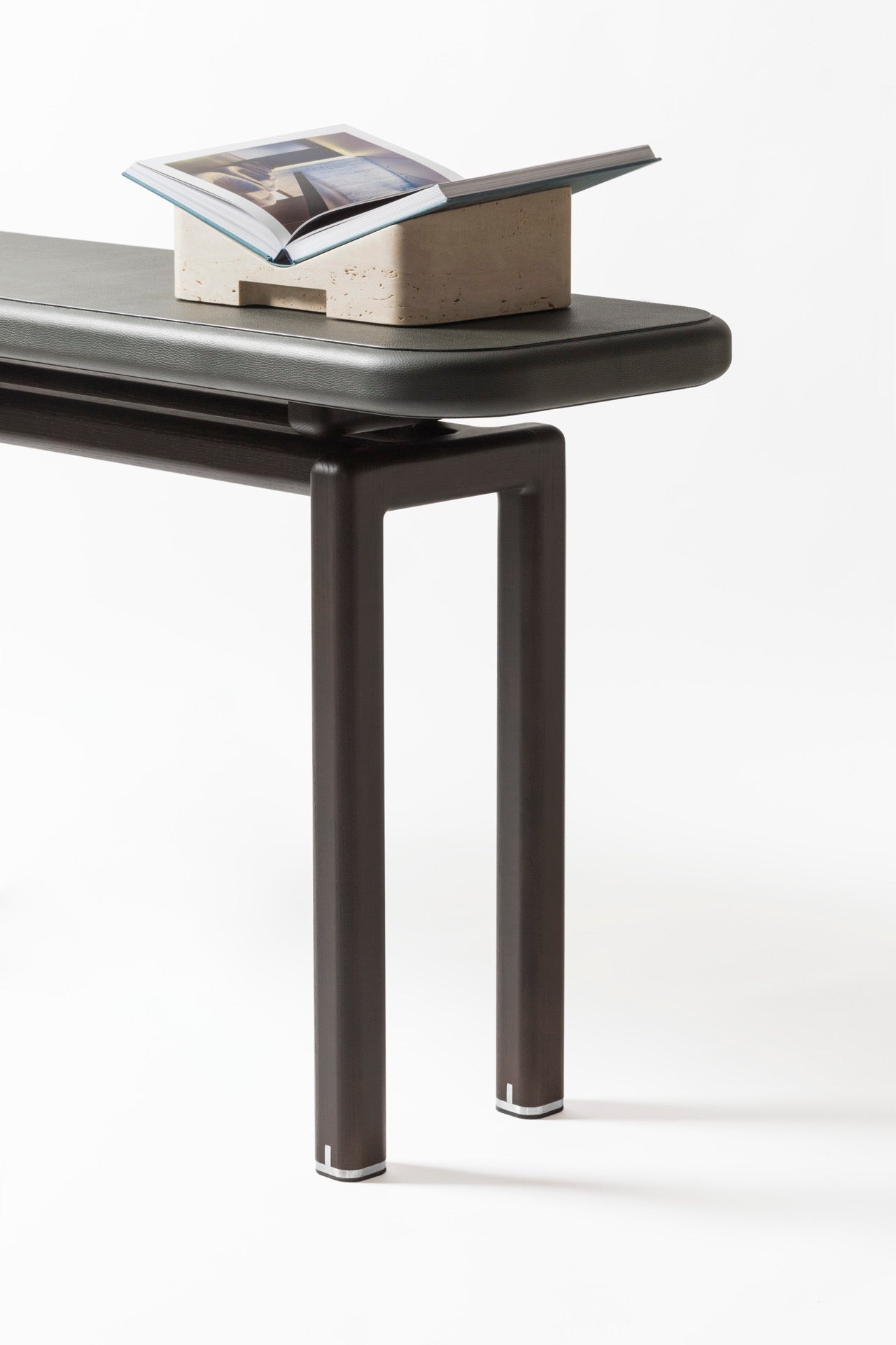Giobagnara × Glenn Sestig | Lloyd Console: Leather and Canaletto walnut with iron or brushed bronze feet | Furniture / Console Tables + Étageres | 2Jour Concierge, your luxury lifestyle shop | modern craftsmanship, Italian design, sculptural interiors, refined living