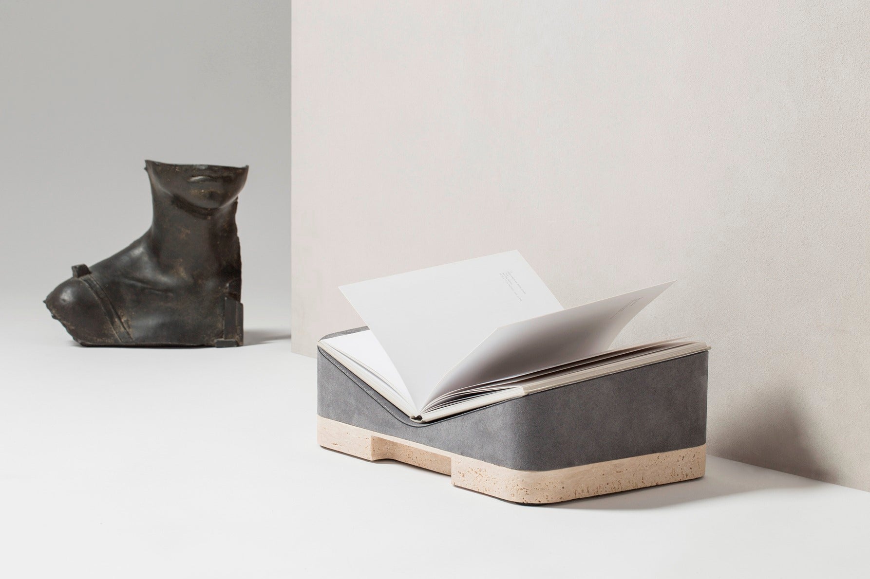 Giobagnara x Glenn Sestig Lloyd Bookstand | Versatile bookstand crafted in luxurious leather and solid wood—choose between dark-stained Canaletto walnut or wenge finishes—and also available in leather with travertine marble or full travertine marble constructions | Crafted in Italy by Giobagnara in collaboration with designer Glenn Sestig | Home Decor / Desk Accessories | 2Jour Concierge, your luxury lifestyle shop