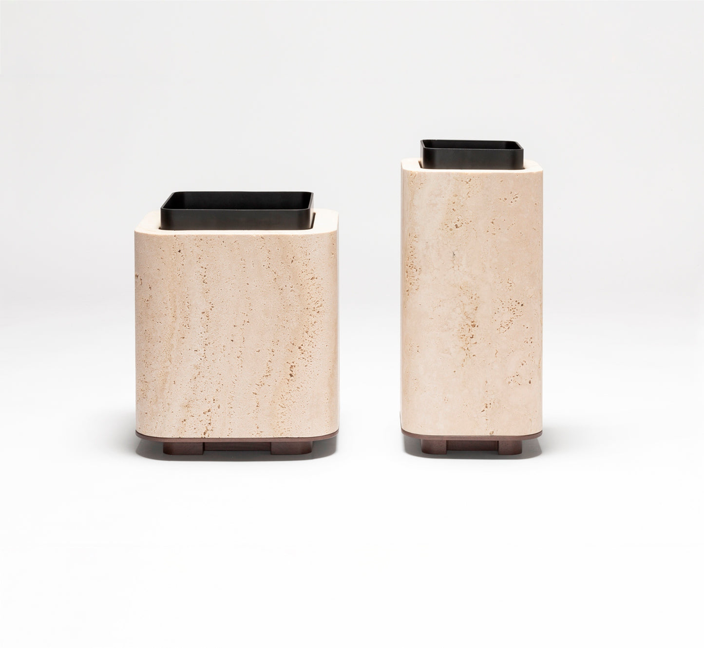Giobagnara x Glenn Sestig Lloyd Vase | Travertine structure with a removable burnished-brushed bronze container seated on a walnut- or wenge-finished wood base, blending organic stone with metallic warmth | Crafted in Italy by Giobagnara in collaboration with designer Glenn Sestig | Home Decor / Vases | 2Jour Concierge, your luxury lifestyle shop