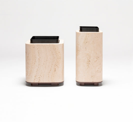 Giobagnara x Glenn Sestig Lloyd Vase | Travertine structure with a removable burnished-brushed bronze container seated on a walnut- or wenge-finished wood base, blending organic stone with metallic warmth | Crafted in Italy by Giobagnara in collaboration with designer Glenn Sestig | Home Decor / Vases | 2Jour Concierge, your luxury lifestyle shop