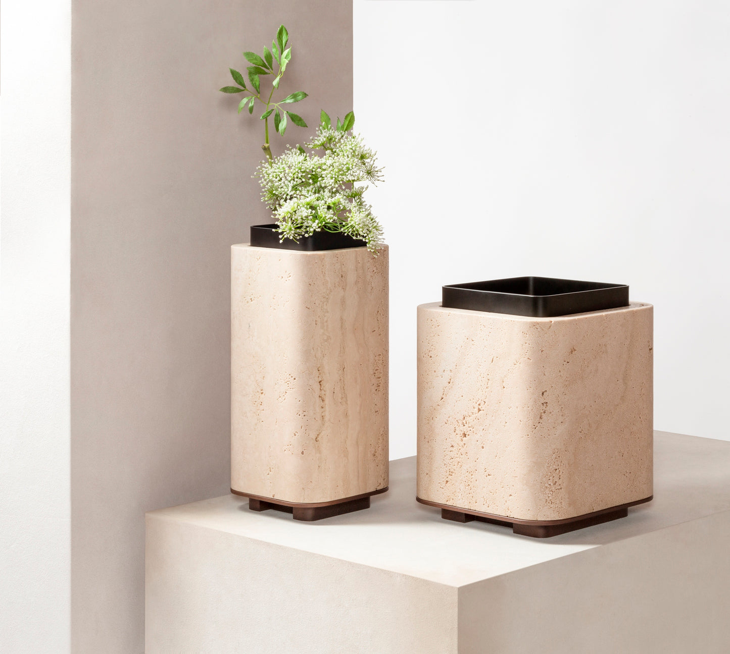 Giobagnara x Glenn Sestig Lloyd Vase | Travertine structure with a removable burnished-brushed bronze container seated on a walnut- or wenge-finished wood base, blending organic stone with metallic warmth | Crafted in Italy by Giobagnara in collaboration with designer Glenn Sestig | Home Decor / Vases | 2Jour Concierge, your luxury lifestyle shop