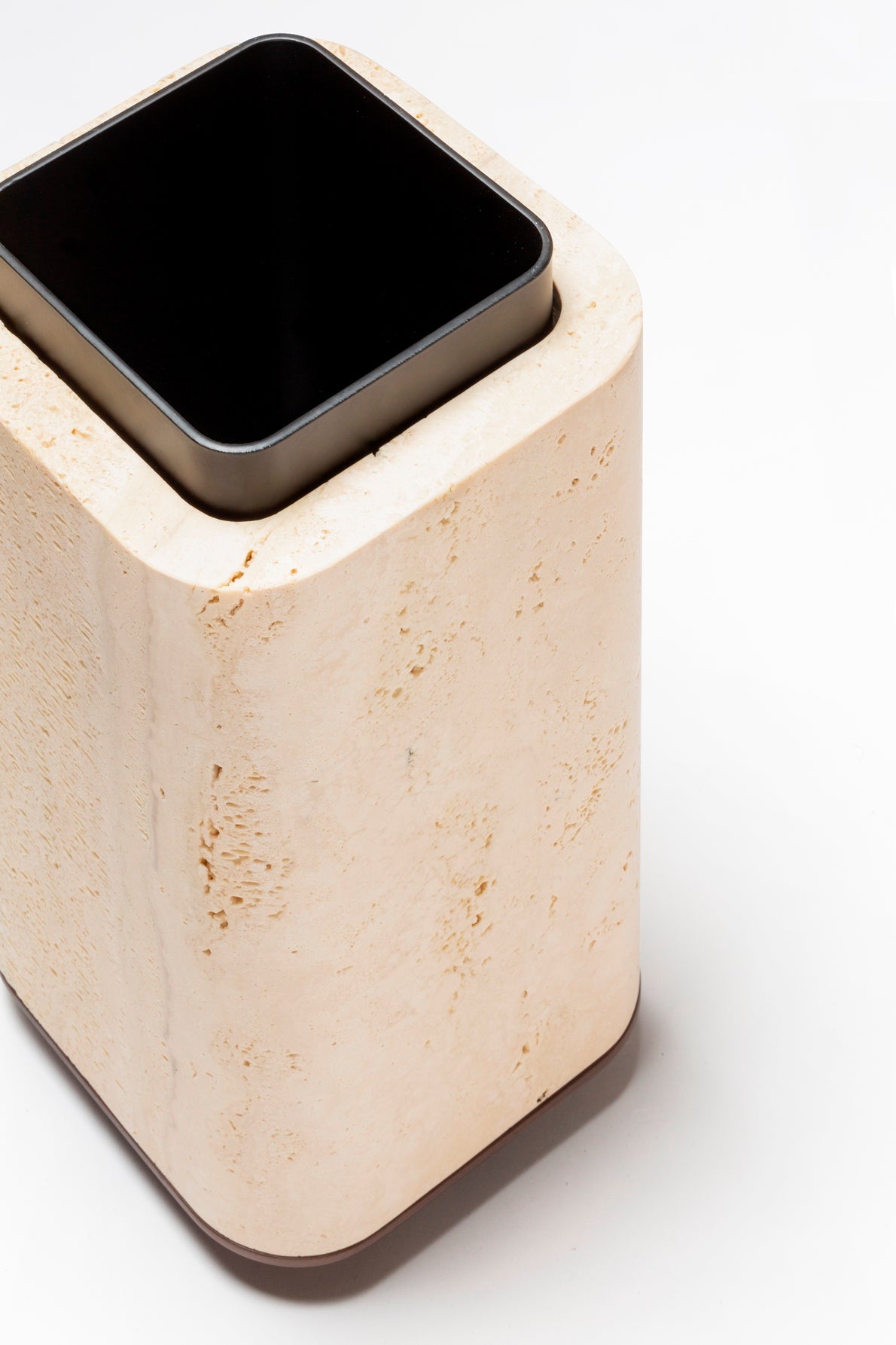 Giobagnara x Glenn Sestig Lloyd Vase | Travertine structure with a removable burnished-brushed bronze container seated on a walnut- or wenge-finished wood base, blending organic stone with metallic warmth | Crafted in Italy by Giobagnara in collaboration with designer Glenn Sestig | Home Decor / Vases | 2Jour Concierge, your luxury lifestyle shop