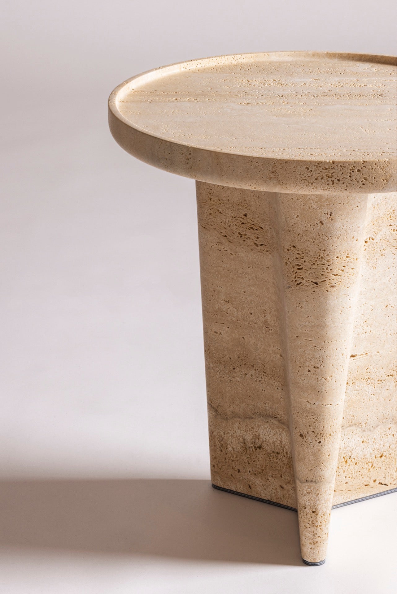 Giobagnara × Glenn Sestig Tanell | Travertine Round Side Tables: Sculptural base in classic or titanium travertine with smooth circular top | Furniture / Side Tables + Bar Tables | 2Jour Concierge, your luxury lifestyle shop | luxury interiors, refined living, boutique hotels, designer furniture, yacht décor, hospitality spaces, contemporary stone design