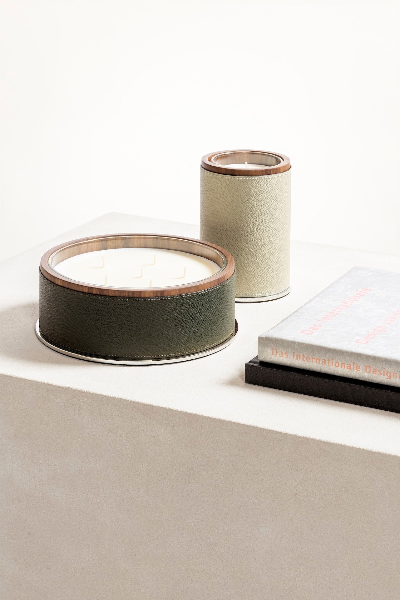 Giobagnara Positano | Candle Holder: Leather with walnut wood trim and metal base, smooth finish, with removable wax candle insert | Decor / Vases & Candle Holders | 2Jour Concierge, your luxury lifestyle shop | luxury interiors, hospitality décor, elegant living, designer home accessories, boutique hotels, refined lifestyle, yacht décor