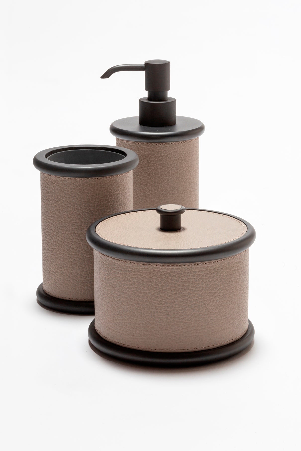 Giobagnara Ravello soap dispenser | Part of the Ravello bathroom collection | Elegant cylindrical form softened by rounded details and covered in velvety Italian leather | Non-slip waterproof base | Available in chrome, bronze, or brass finishes | Bathroom accessories | 2Jour Concierge, your luxury lifestyle shop