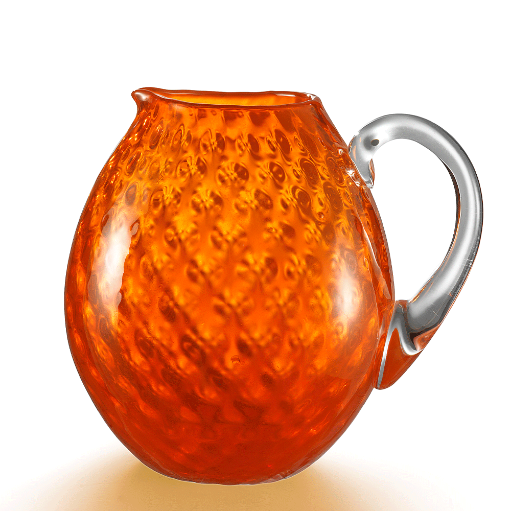 NasonMoretti Idra pitcher | Handcrafted Murano glass pitcher with iconic balloton texture | Rounded form with a crystal-clear sculpted handle for elegant pouring | Available in a vivid color palette including avio blue, grey, red, orange, soraya green, and purple | A bold yet refined statement piece for stylish entertaining | Design by NasonMoretti | Tableware & serveware | 2Jour Concierge, your luxury lifestyle shop