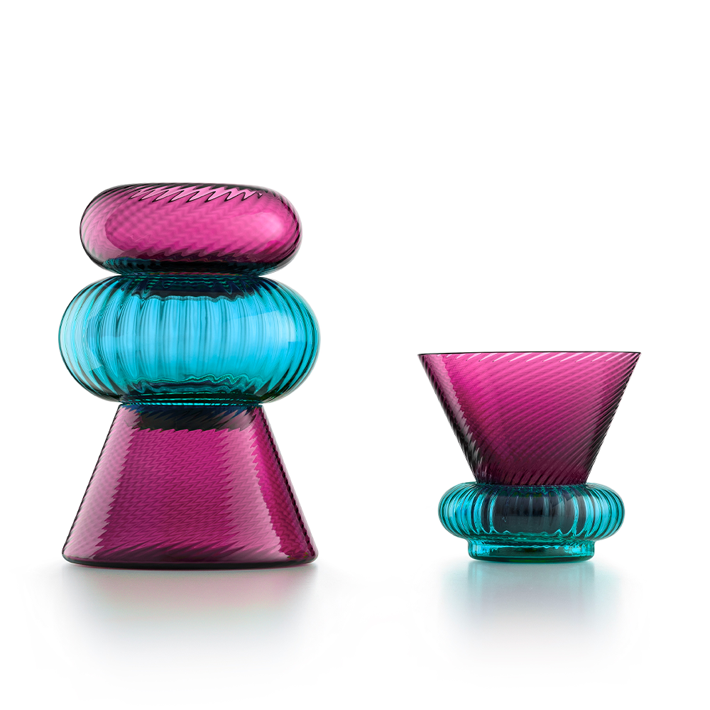 NasonMoretti Issey vase set | A vibrant set of 5 Murano glass vases, designed by Matteo Zorzenoni | Defined by playful modularity and stacked sculptural silhouettes, each vase brings a dynamic presence to the space | Available in expressive color duos: pine green & amber or ruby red & turquoise, with twisted and striped textures | A bold, tactile composition for modern interiors | Design by NasonMoretti | Tableware & decorative objects | 2Jour Concierge, your luxury lifestyle shop