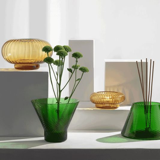 NasonMoretti Issey vase set | A vibrant set of 5 Murano glass vases, designed by Matteo Zorzenoni | Defined by playful modularity and stacked sculptural silhouettes, each vase brings a dynamic presence to the space | Available in expressive color duos: pine green & amber or ruby red & turquoise, with twisted and striped textures | A bold, tactile composition for modern interiors | Design by NasonMoretti | Tableware & decorative objects | 2Jour Concierge, your luxury lifestyle shop