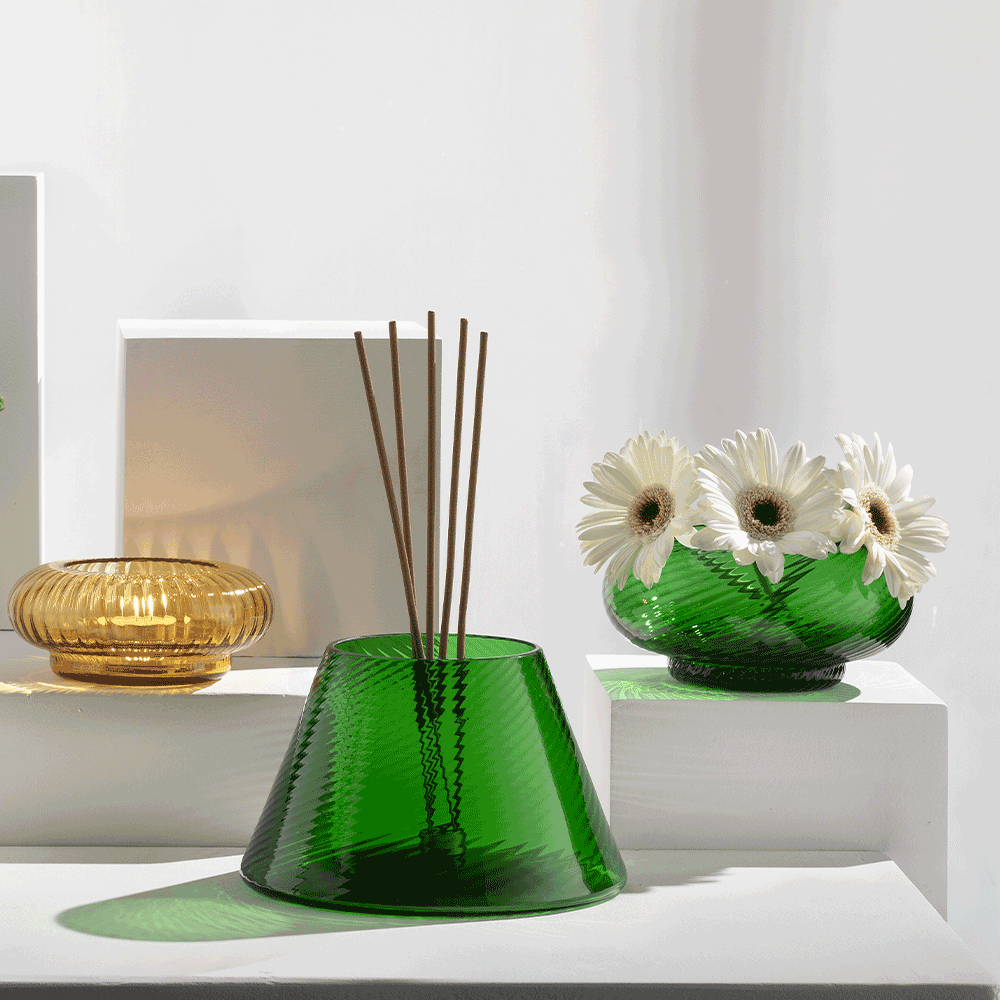 NasonMoretti Issey vase set | A vibrant set of 5 Murano glass vases, designed by Matteo Zorzenoni | Defined by playful modularity and stacked sculptural silhouettes, each vase brings a dynamic presence to the space | Available in expressive color duos: pine green & amber or ruby red & turquoise, with twisted and striped textures | A bold, tactile composition for modern interiors | Design by NasonMoretti | Tableware & decorative objects | 2Jour Concierge, your luxury lifestyle shop