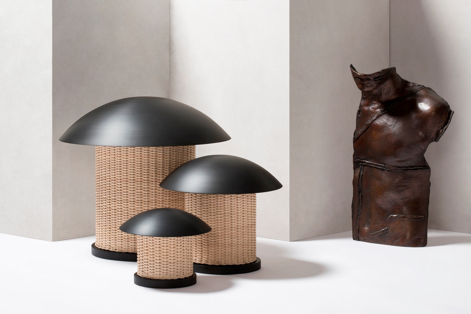 Giobagnara x Stéphane Parmentier Duomo Table Lamp | Vintage-inspired Design with Modern Minimalism | Sculptural Appearance with Geometrical Volumes | Crafted with Curved Bronze Lampshades and Woven Rattan Bases | Casts Soft Ambient Light for Reading and Lounging | Available at 2Jour Concierge, #1 luxury high-end gift & lifestyle shop