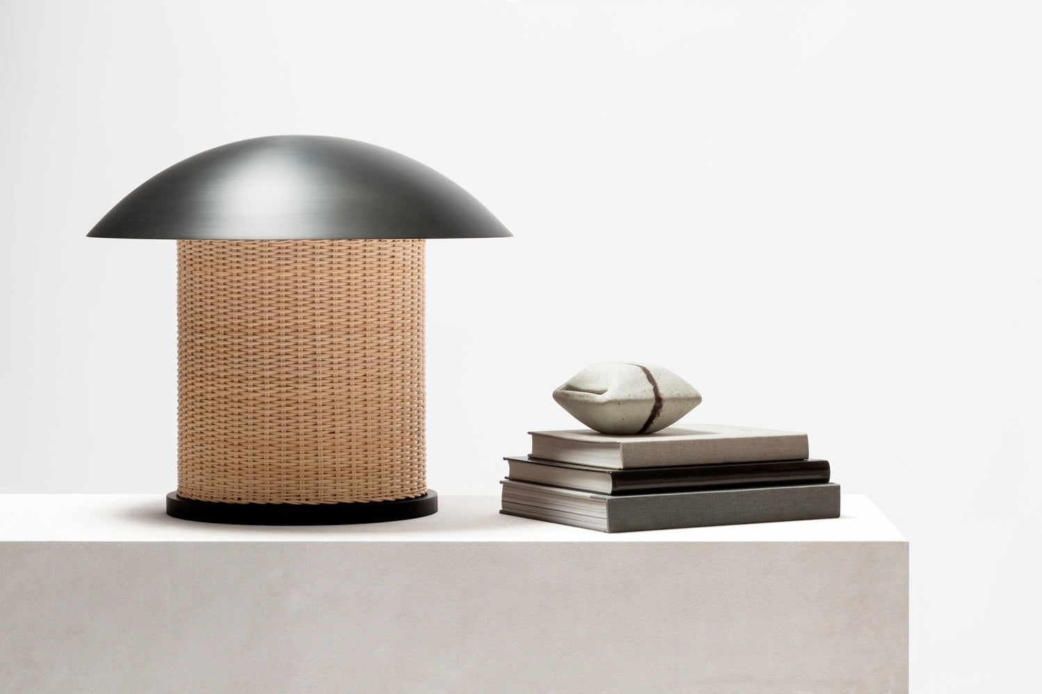 Giobagnara x Stéphane Parmentier Duomo Table Lamp | Vintage-inspired Design with Modern Minimalism | Sculptural Appearance with Geometrical Volumes | Crafted with Curved Bronze Lampshades and Woven Rattan Bases | Casts Soft Ambient Light for Reading and Lounging | Available at 2Jour Concierge, #1 luxury high-end gift & lifestyle shop