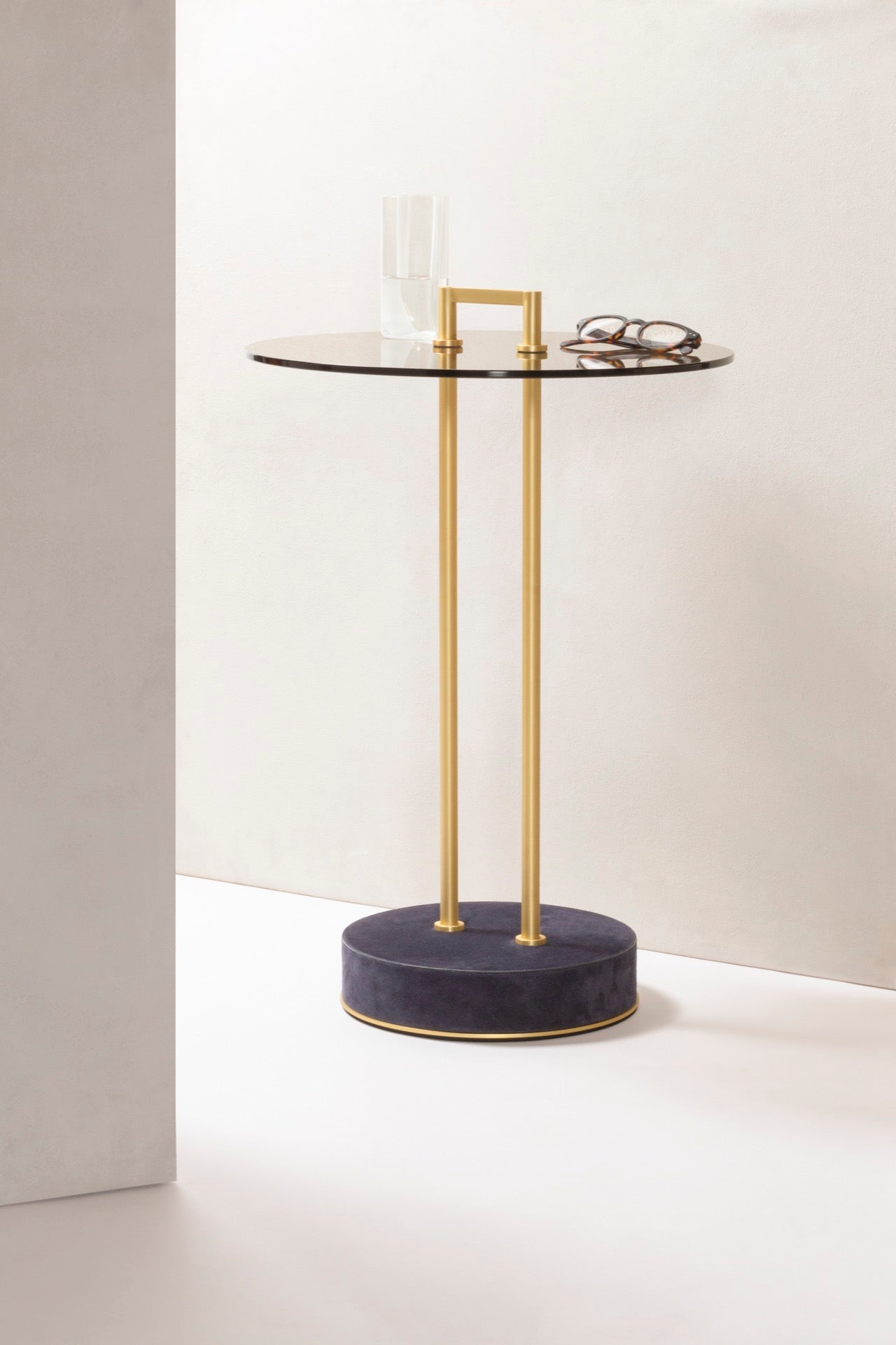 Giobagnara Urbino | Occasional Table: Metal structure with leather-covered base and glass top in transparent or dark bronze | Furniture / Side Tables + Bar Tables | 2Jour Concierge, your luxury lifestyle shop | contemporary interiors, modern elegance, Italian craftsmanship, sculptural furniture