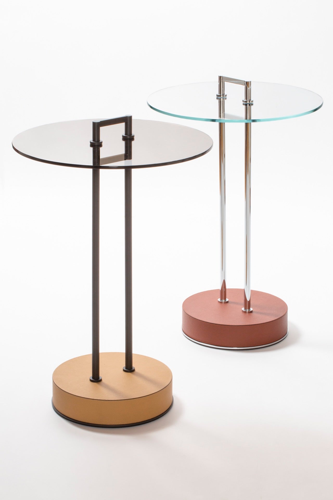 Giobagnara Urbino | Occasional Table: Metal structure with leather-covered base and glass top in transparent or dark bronze | Furniture / Side Tables + Bar Tables | 2Jour Concierge, your luxury lifestyle shop | contemporary interiors, modern elegance, Italian craftsmanship, sculptural furniture