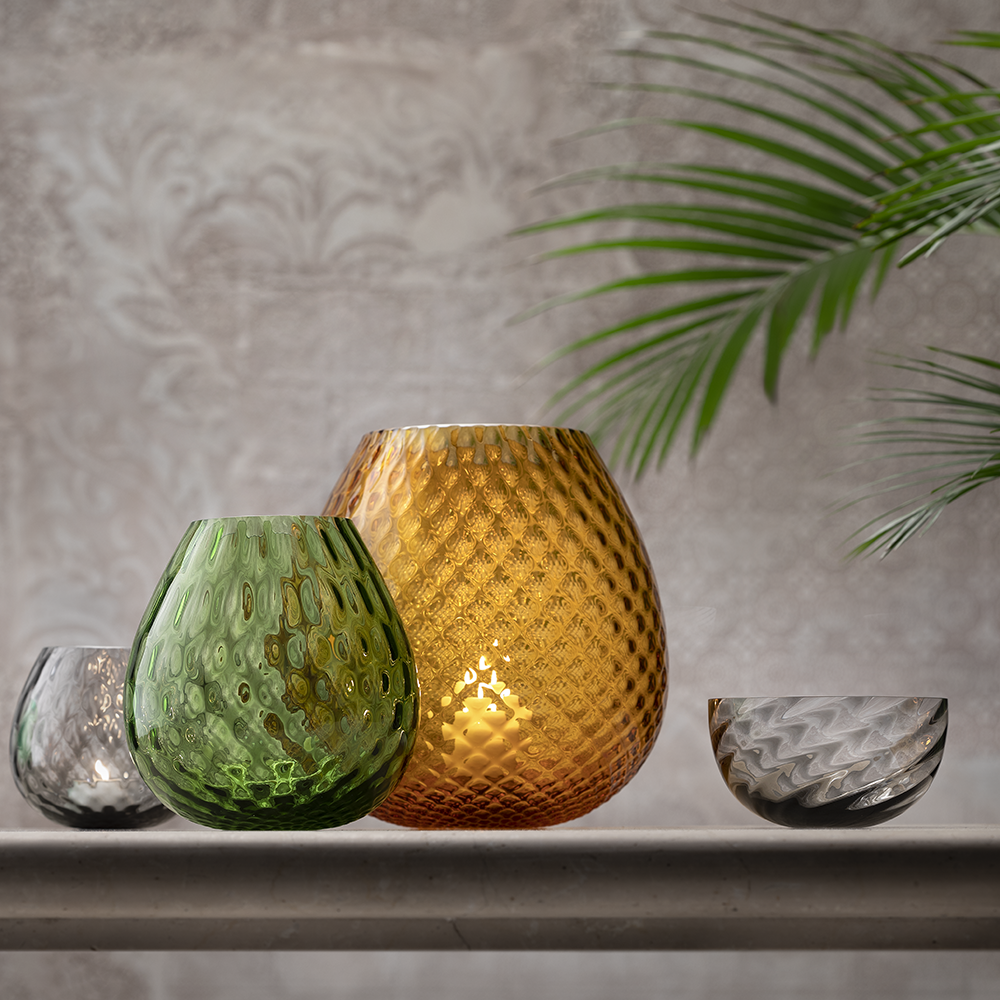 NasonMoretti Macramè candle holders – XL & XXL | Statement pieces handcrafted in Murano glass with refined "balloton" texture | Available in a bold color palette including amber, grey, brown, ruby red, soraya green, and violet | These oversized candle holders bring a sculptural elegance and vibrant glow to any space | Design by NasonMoretti | Home decor & candle holders | 2Jour Concierge, your luxury lifestyle shop