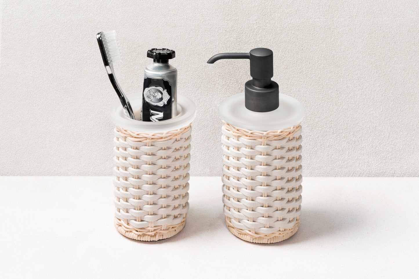 Calais Leather & Rattan Soap Dispenser by Pigment France | Dressed with meticulously woven rattan and leather. Metal finishes available: polished chrome, brushed brass, and brushed bronze. | Bathroom Accessories and Decor | 2Jour Concierge, your luxury lifestyle shop