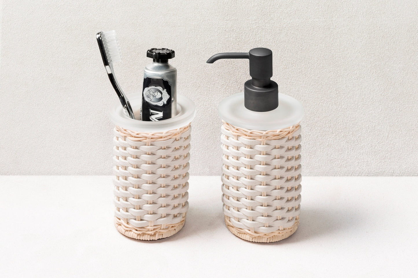 Calais Leather & Rattan Soap Dispenser by Pigment France | Dressed with meticulously woven rattan and leather. Metal finishes available: polished chrome, brushed brass, and brushed bronze. | Bathroom Accessories and Decor | 2Jour Concierge, your luxury lifestyle shop