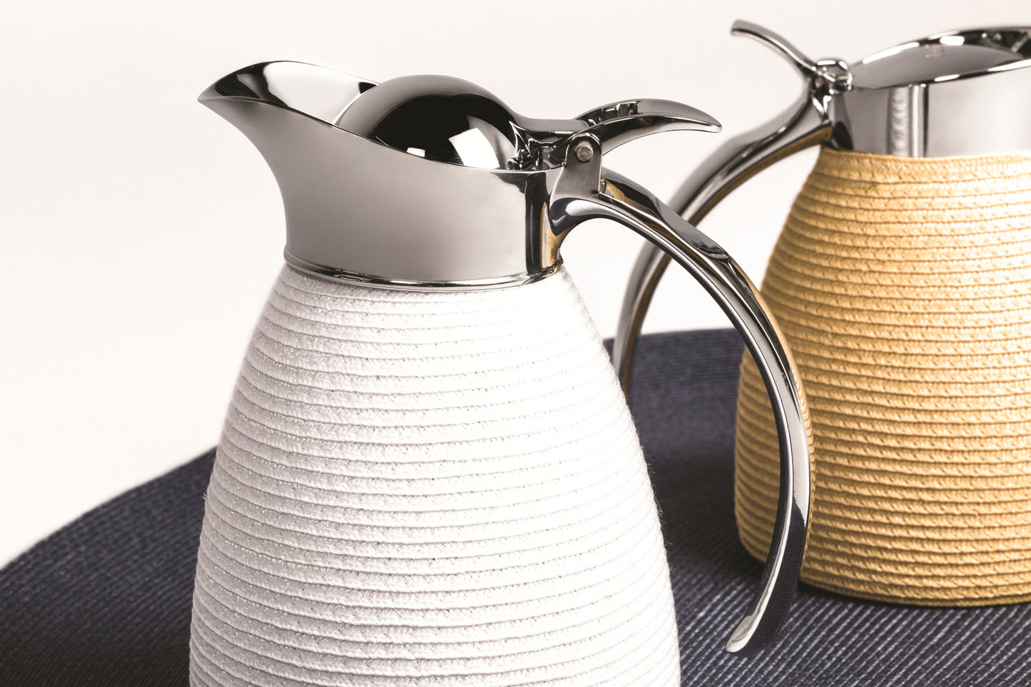 Pigment France Amboise Carafe | Insulated stainless steel carafe partially covered in TechStraw with chrome-plated finish | Two-chamber structure maintains liquid temperature | Features a specially developed hinged lid for precise, one-hand operation | Home Decor and Serveware | 2Jour Concierge, your luxury lifestyle shop