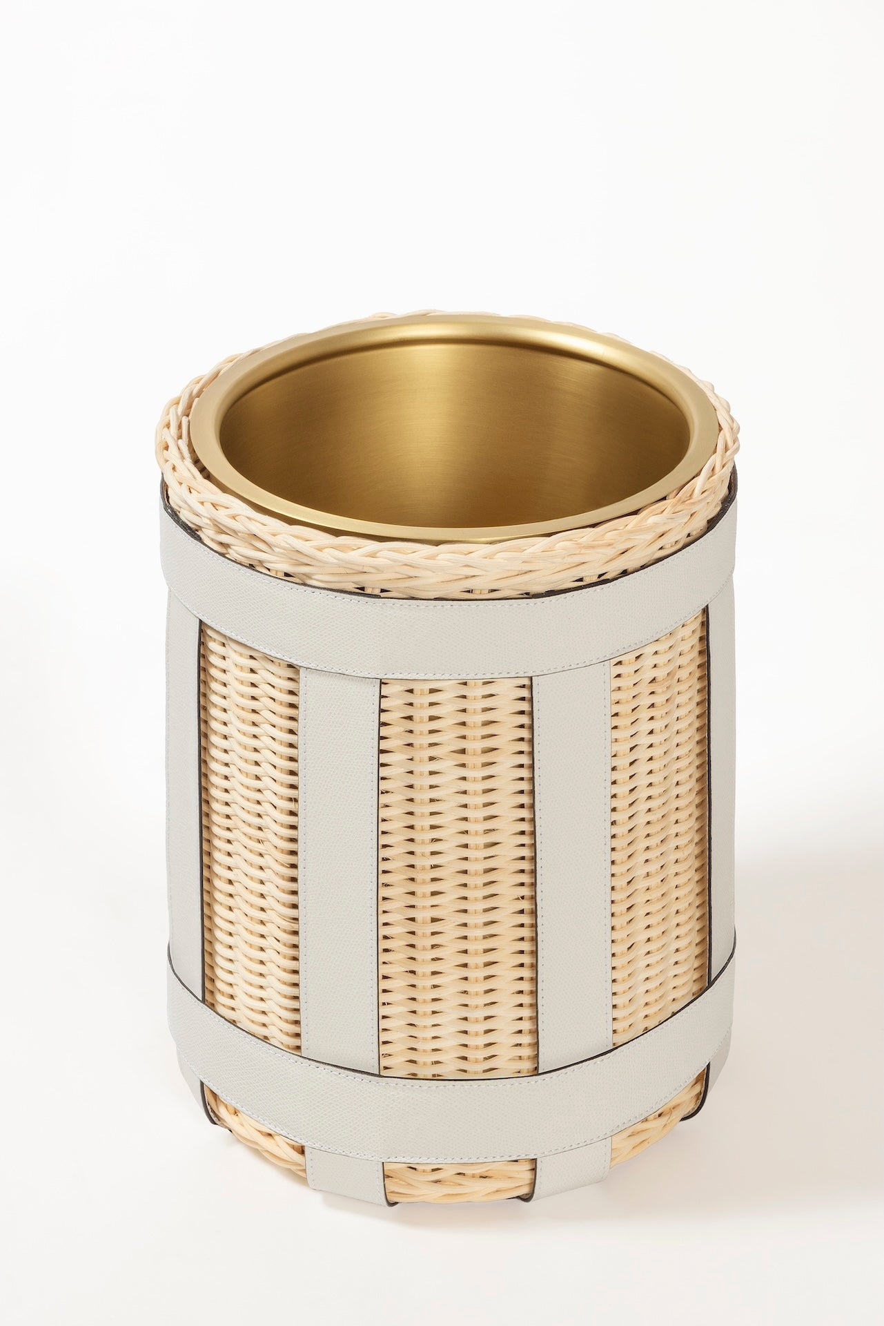 Pigment France × Gio Minelli Sillon Bin | Storage bin in natural rattan with leather trim and polished chrome, bronze or brass finish | Storage / Bins | 2Jour Concierge, your luxury lifestyle shop | luxury interiors, hospitality décor, designer home accessories, boutique hotels, refined lifestyle, yacht décor, office décor, executive interiors