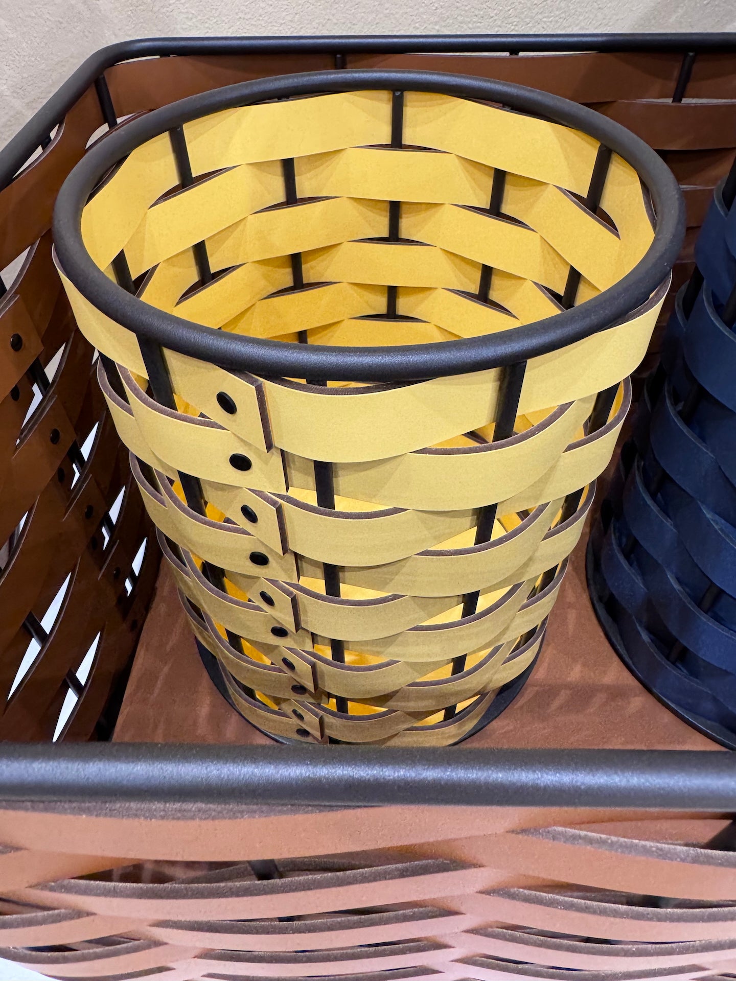 Nassa Storage Basket: Dark-Stained Aluminum Framework, Regenerated Leather Weaving, Round