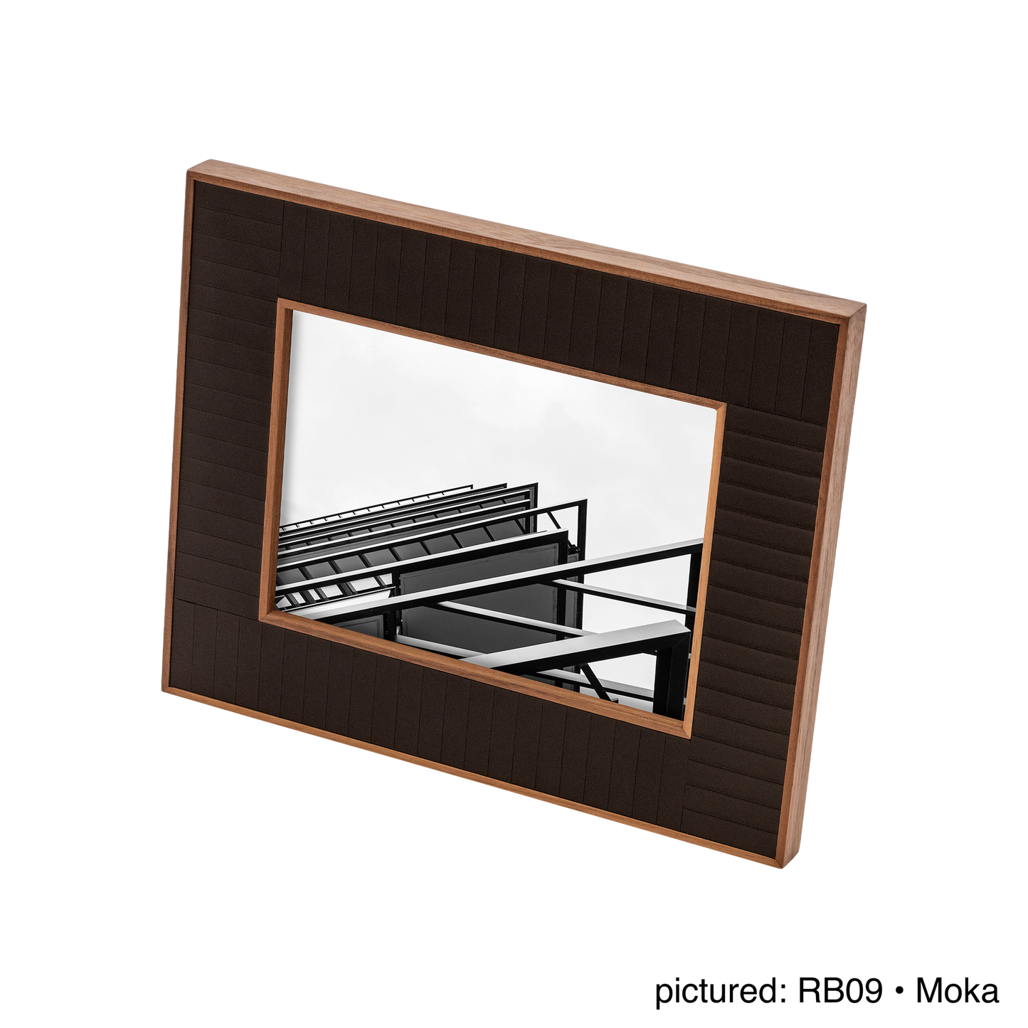 Rabitti 1969 | Toiles de Noyer Walnut Wood and Saddle Leather Picture Frame N°2: Walnut wood picture frame with saddle leather inserts engraved with vertical and horizontal stripes, two sizes, magnetic back | Decor | 2Jour Concierge, your luxury lifestyle shop | luxury picture frame, Rabitti 1969, Toiles de Noyer, walnut leather frame, engraved leather detail, Italian luxury decor, designer photo frame, Giobagnara leather frame