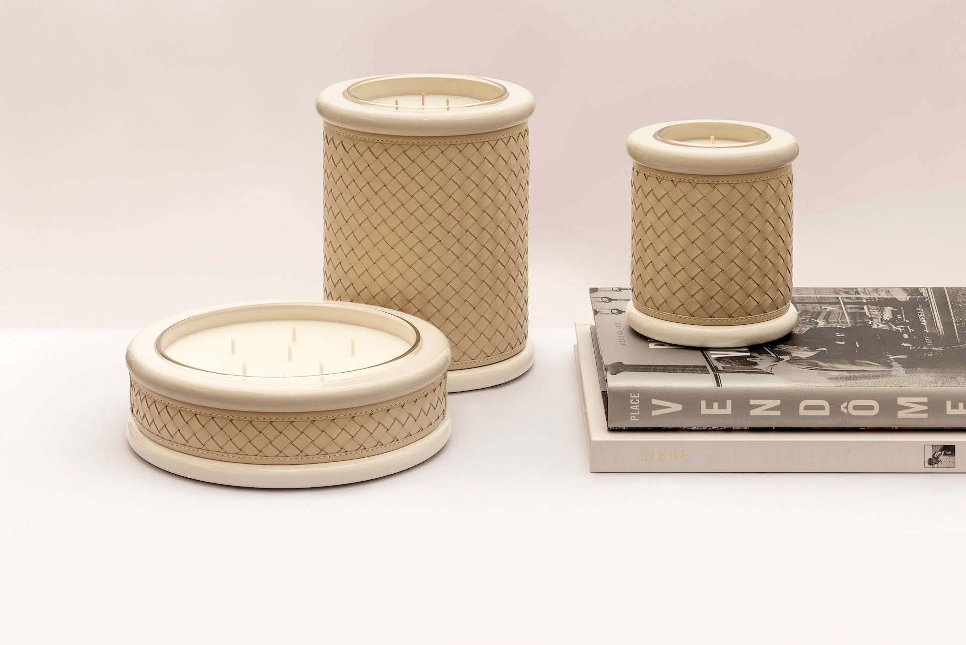 Riviere Maia | Candle Holder: Handwoven leather with lacquered wood and lacquer rings, available in multiple sizes, refined craftsmanship for display or use | Decor / Vases & Candle Holders | 2Jour Concierge, your luxury lifestyle shop | luxury interiors, hospitality décor, elegant living, designer home accessories, boutique hotels, refined lifestyle, yacht décor