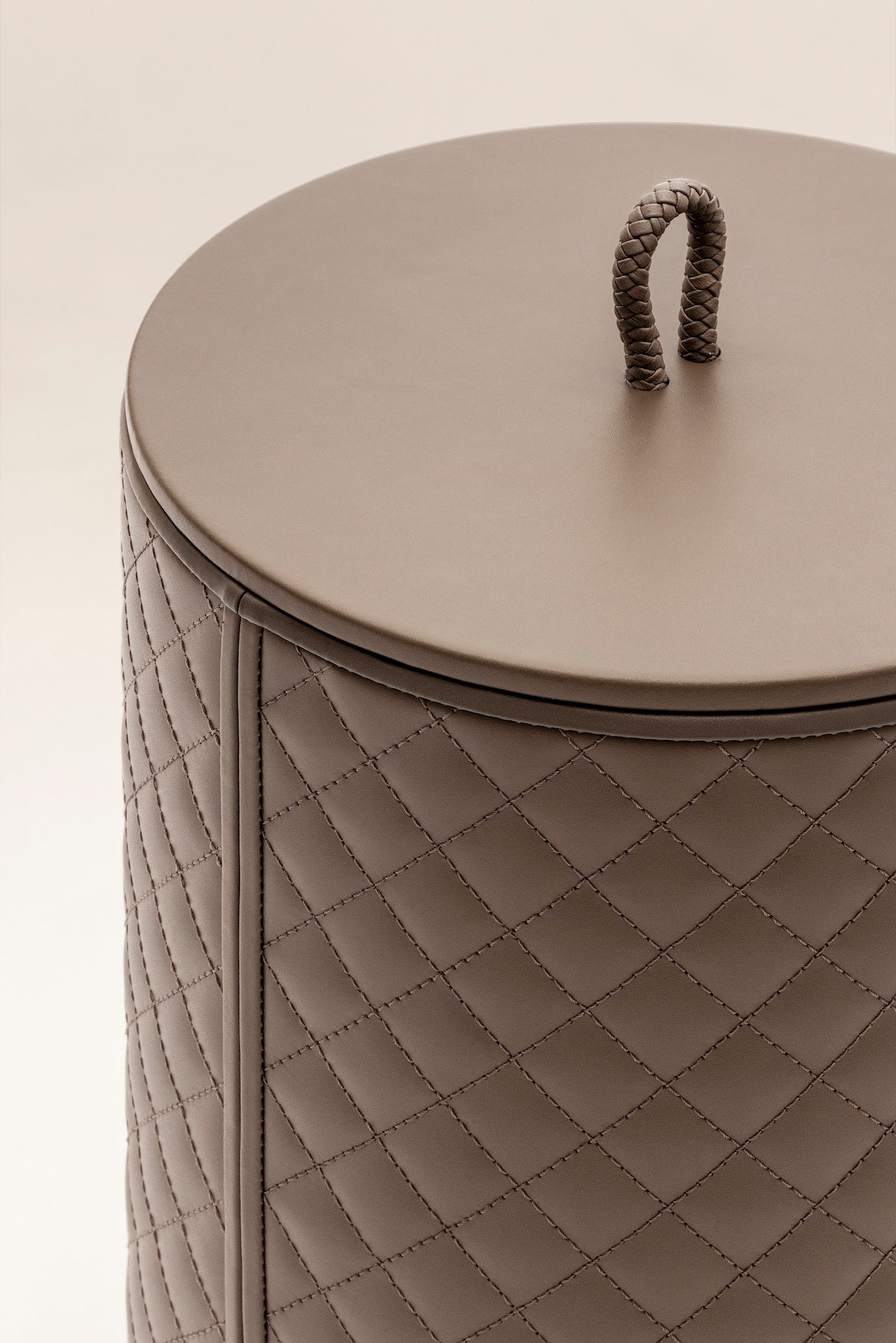 Riviere Ivo | Round Bin: Leather with varnished wood lining, offered in handwoven, herringbone, diamond, or lines quilted patterns, in two height options, with matching lid and acrylic lining accessories | Office + Tech / Bins | 2Jour Concierge, your luxury lifestyle shop | luxury interiors, hospitality décor, elegant living, designer office accessories, boutique hotels, refined lifestyle, yacht décor, executive interiors