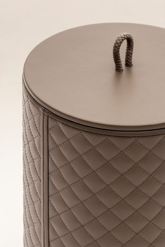 Riviere Ivo | Round Bin: Leather with varnished wood lining, offered in handwoven, herringbone, diamond, or lines quilted patterns, in two height options, with matching lid and acrylic lining accessories | Office + Tech / Bins | 2Jour Concierge, your luxury lifestyle shop | luxury interiors, hospitality décor, elegant living, designer office accessories, boutique hotels, refined lifestyle, yacht décor, executive interiors