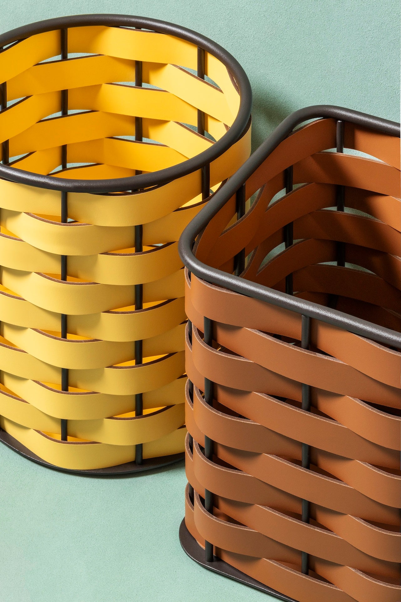 Rudi Nassa | Basket: Regenerated leather with woven structure, dark-stained aluminum frame, and smooth, matte finish, ideal for storing laundry, towels, or magazines, suitable for indoor or outdoor use | Storage / Storage Baskets & Boxes | 2Jour Concierge, your luxury lifestyle shop