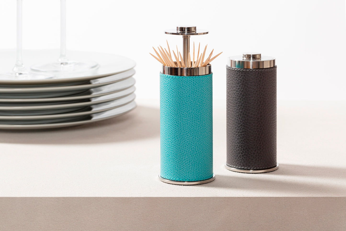 Giobagnara Otello Toothpick Holder | Partially leather-covered stainless steel structure with a discreet push-button top for easy toothpick dispensing | Crafted in Italy by Giobagnara | Serveware & Accessories / Bar Accessories | 2Jour Concierge, your luxury lifestyle shop